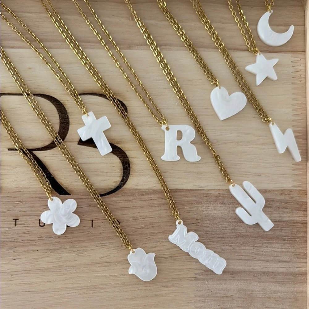 Gold Necklace with White Crescent Pendant